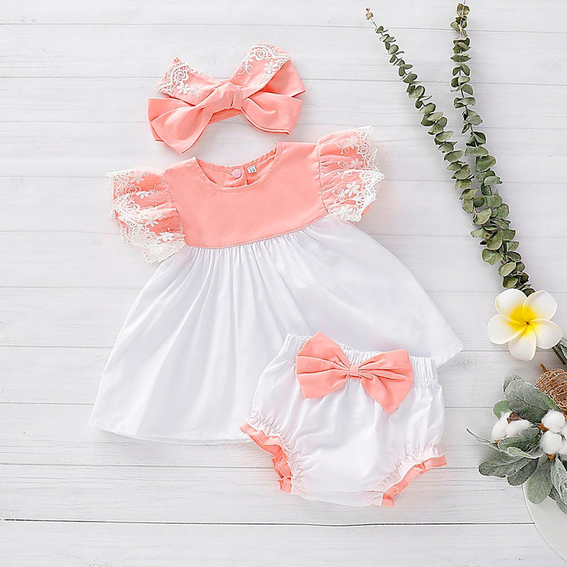 These colors are giving us all the feels. We love the peach and white lace dress with matching bloomers set and of course the matching headband just ties it all together. The colors make us think of sunshine and spring and summer time even though this can totally be worn year round. 